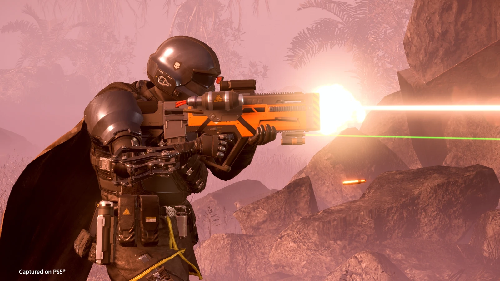 A Helldiver firing the orange SG-225IE Breaker Incendiary shotgun in official PS5 footage.