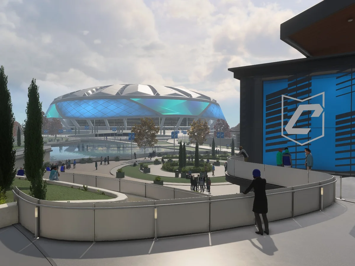 The FC 27 Clubhouse building stands beside the Terrace, with a blue Club emblem above its entrance.