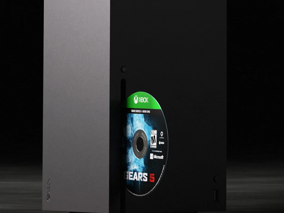 An Xbox Series X console with a Gears 5 disc beside its optical drive.