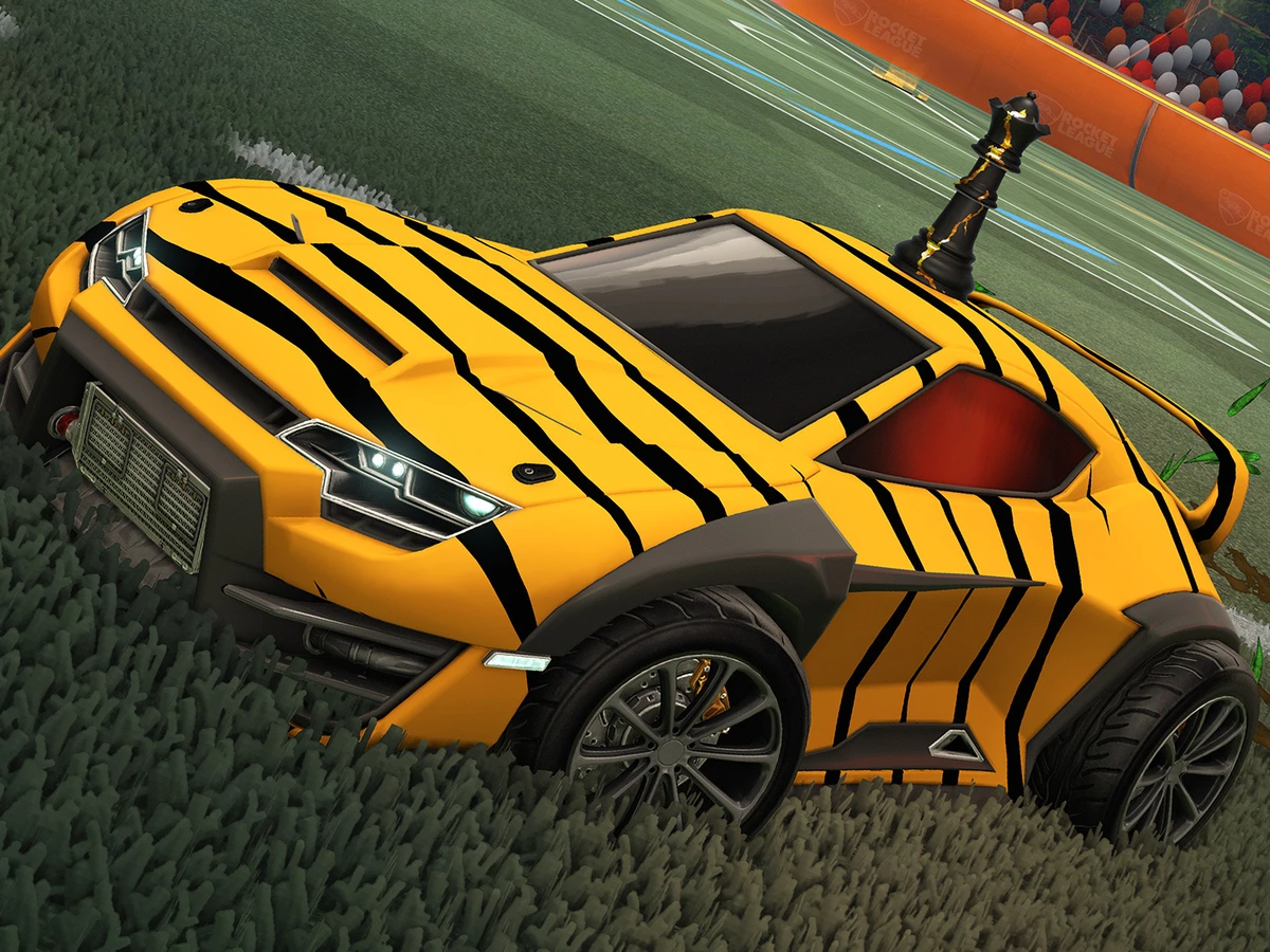 Yellow and black Rocket League car on the pitch in official Season 24 artwork
