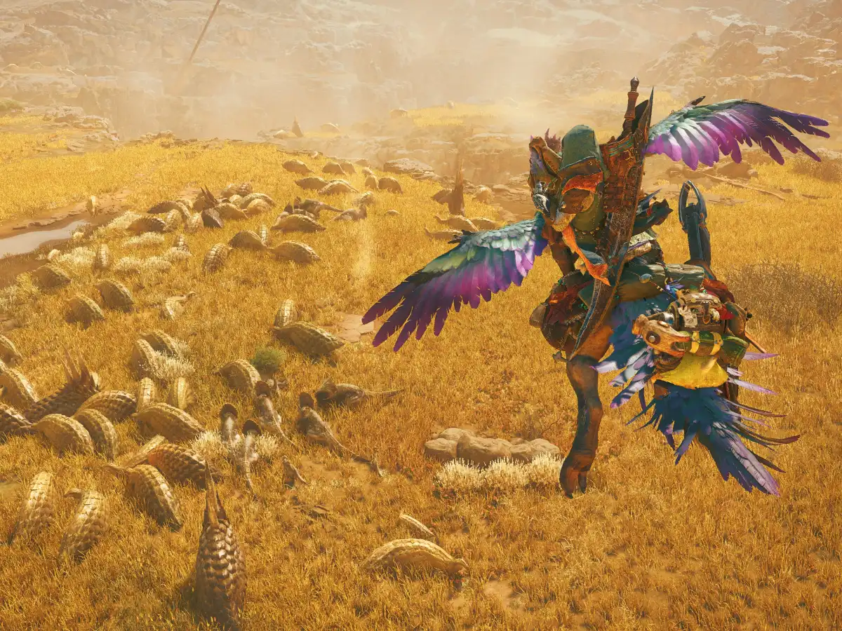 A hunter rides a Seikret through the golden Windward Plains in Monster Hunter Wilds.