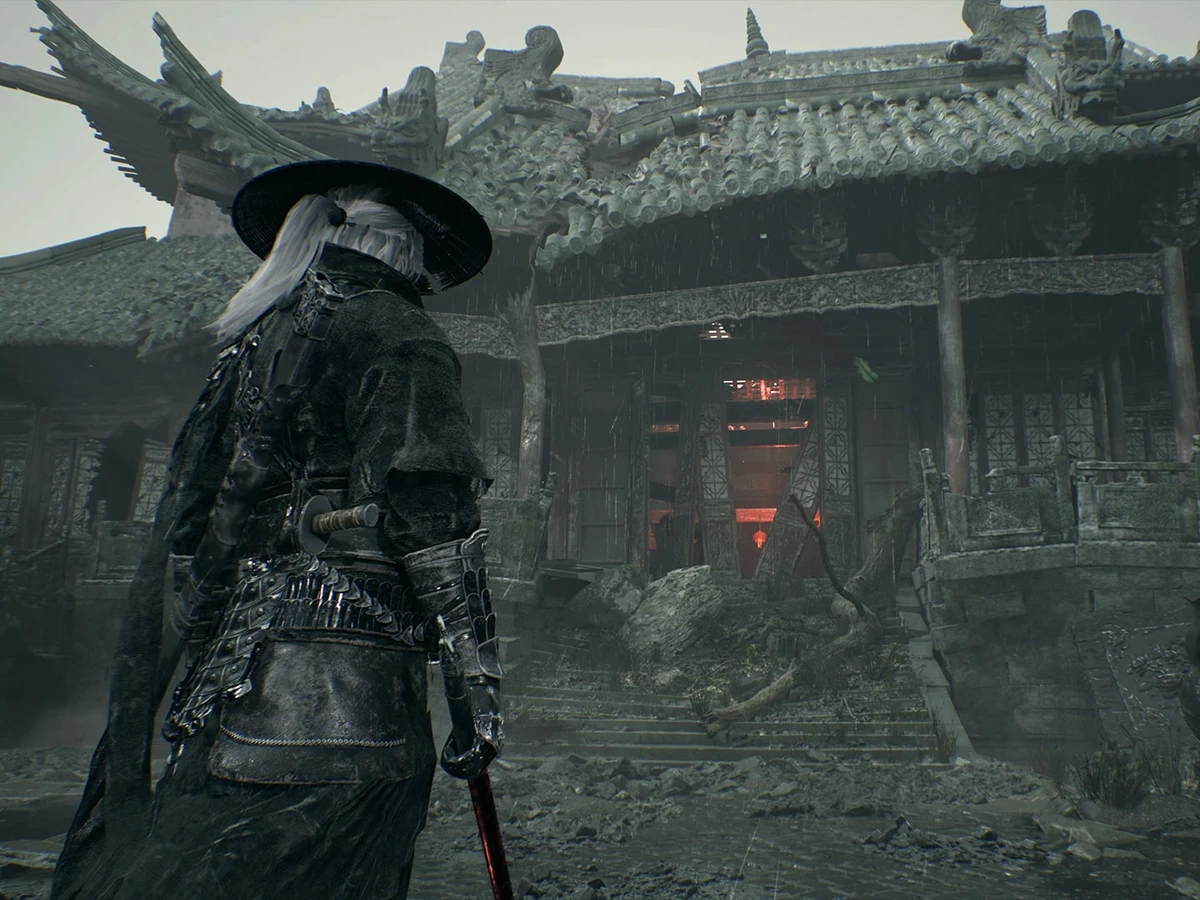 Soul stands before a weathered temple entrance beneath tiled roofs.