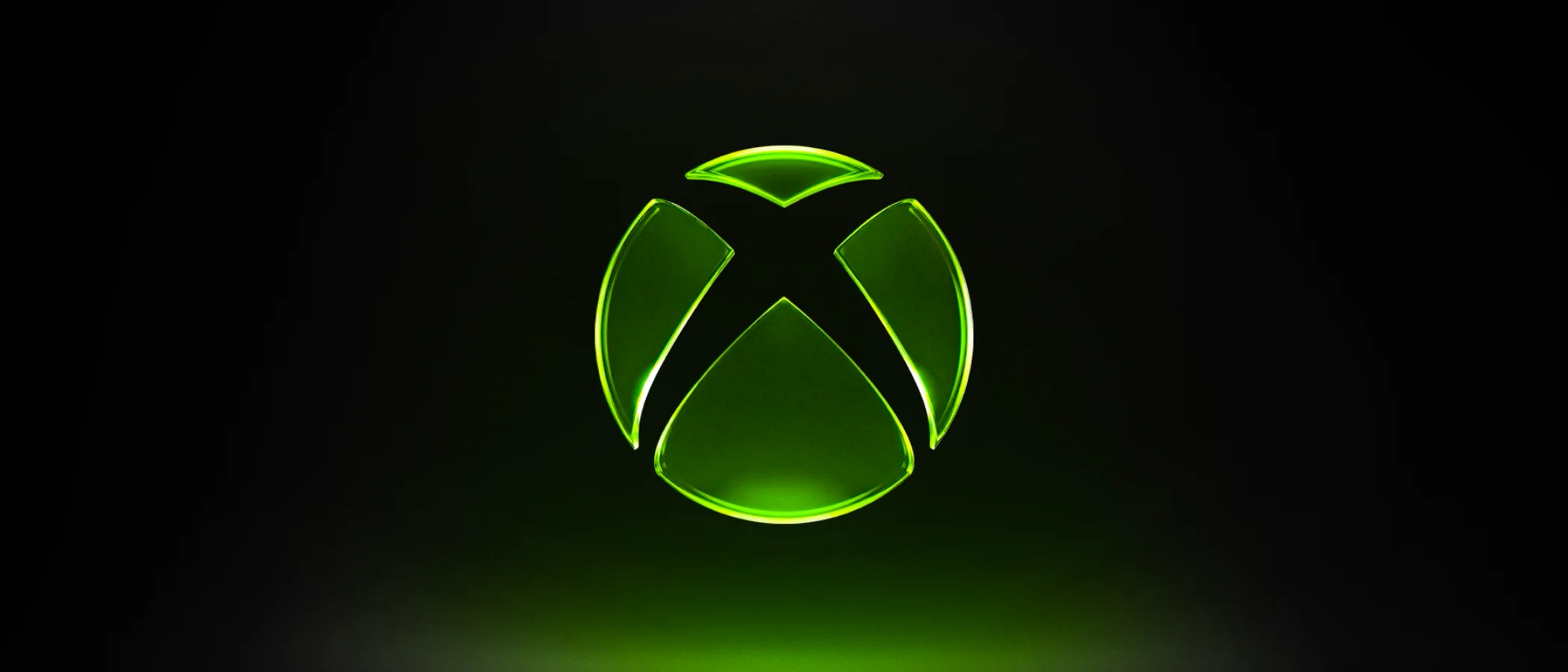 A green Xbox symbol glows against a dark background