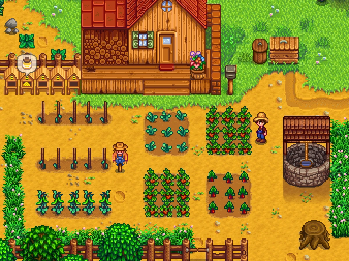 A farmer stands among crops, scarecrows and buildings on a Stardew Valley farm