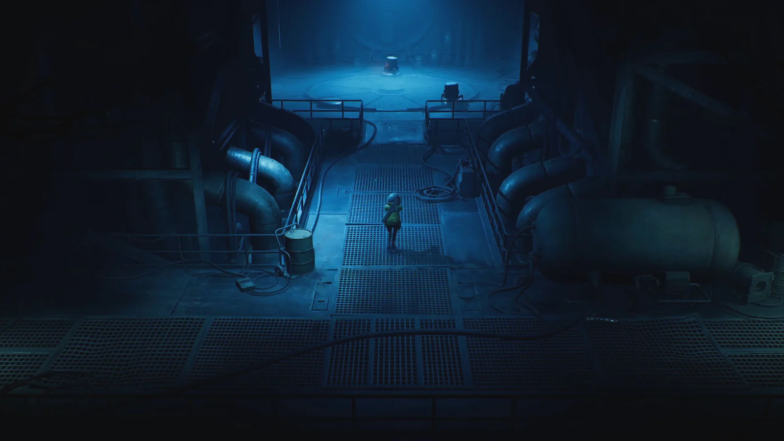 Cel stands on a grated walkway between large pipes in a dark blue industrial chamber