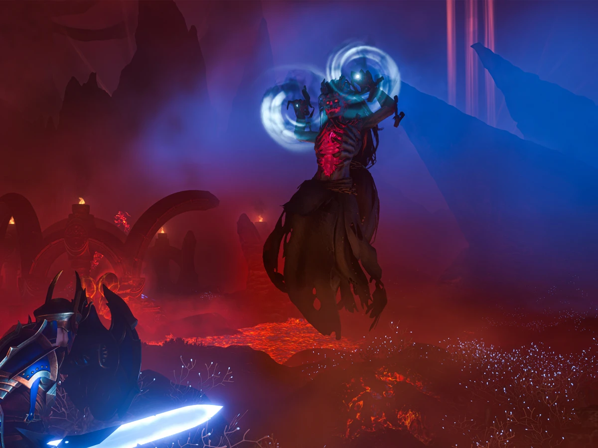 An Enshrouded warrior faces a floating enemy glowing with blue magic.