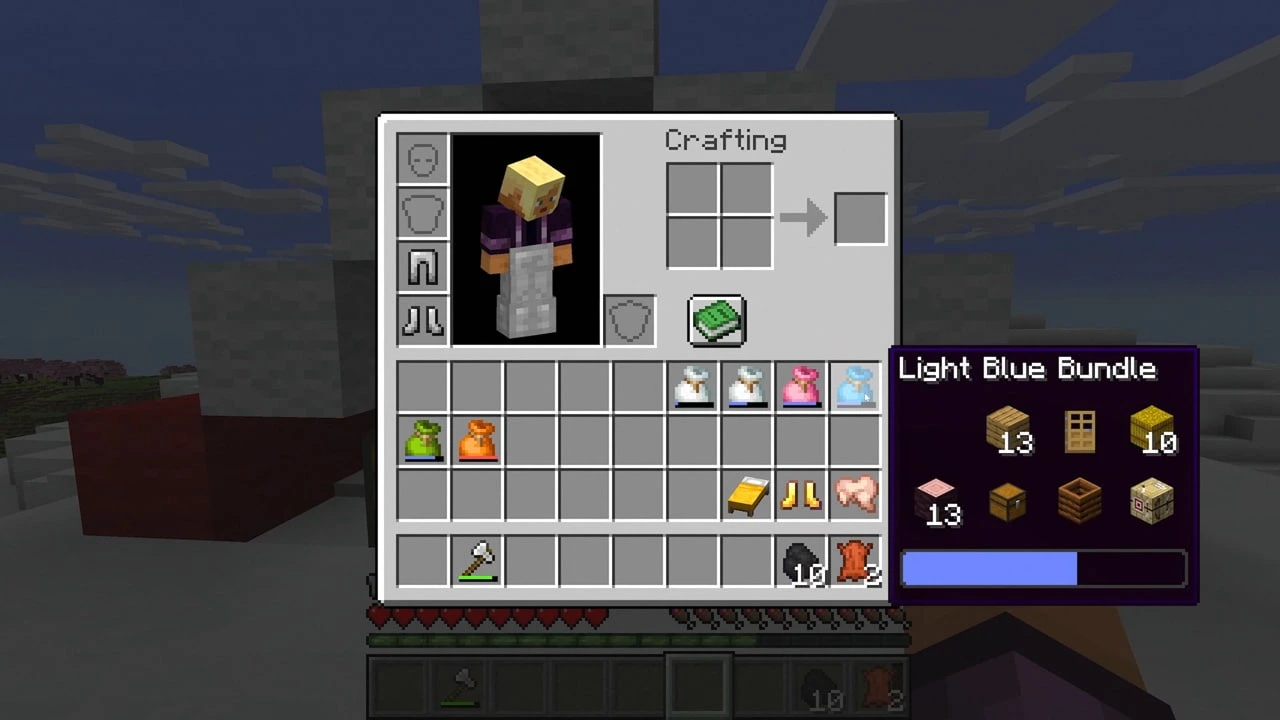 Minecraft inventory showing a light blue bundle with mixed items in its tooltip