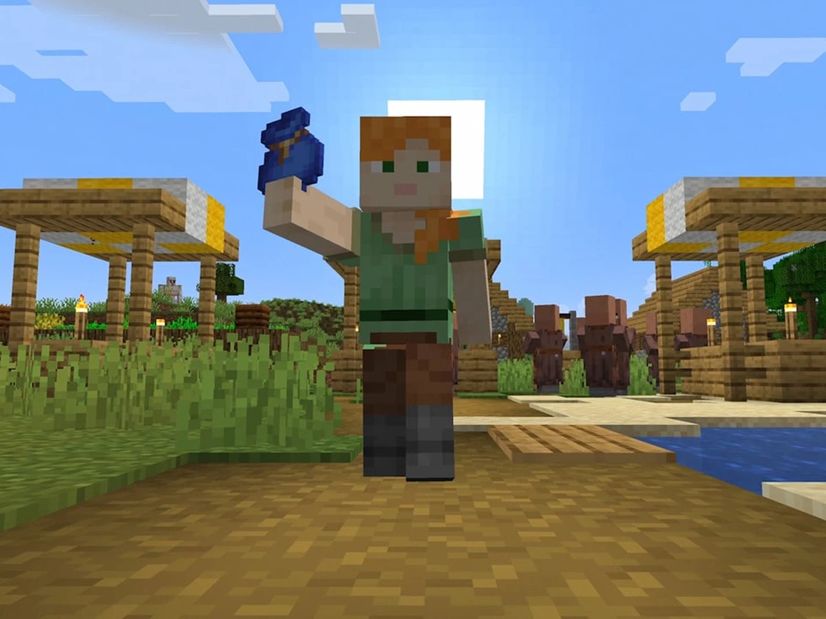 Alex holds up a blue bundle in a Minecraft village beside water