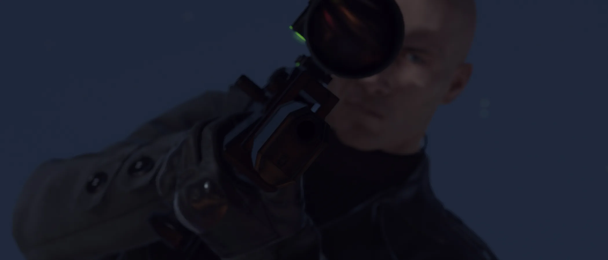 Agent 47 stands among a crowd of guests in a dark interior in HITMAN.