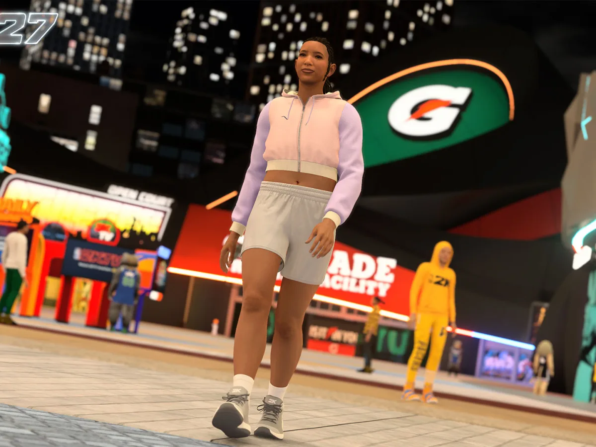 A female MyPLAYER stands on a basketball court in NBA 2K27's City.