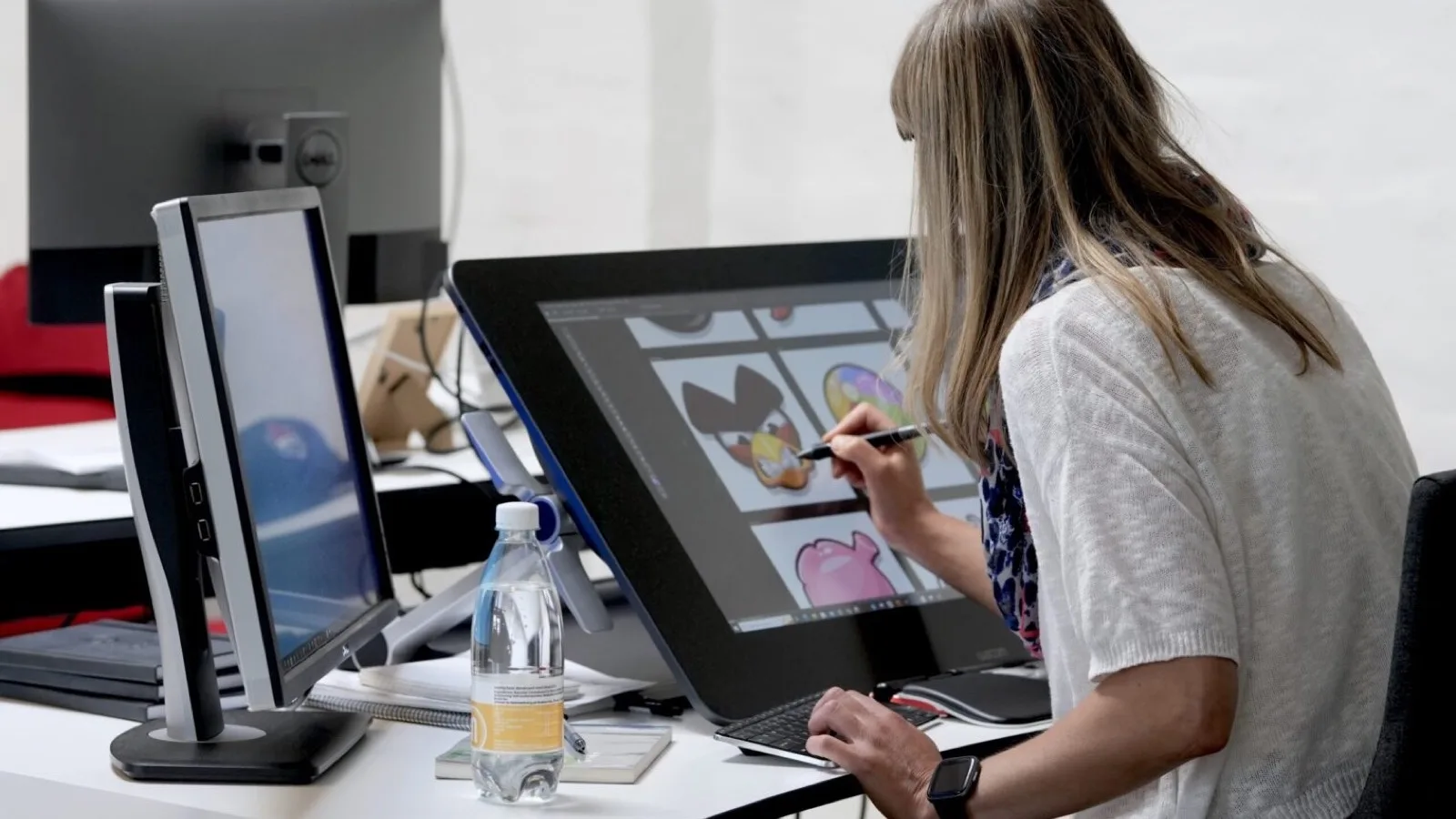 A Rovio artist works at a drawing display in the Copenhagen studio.