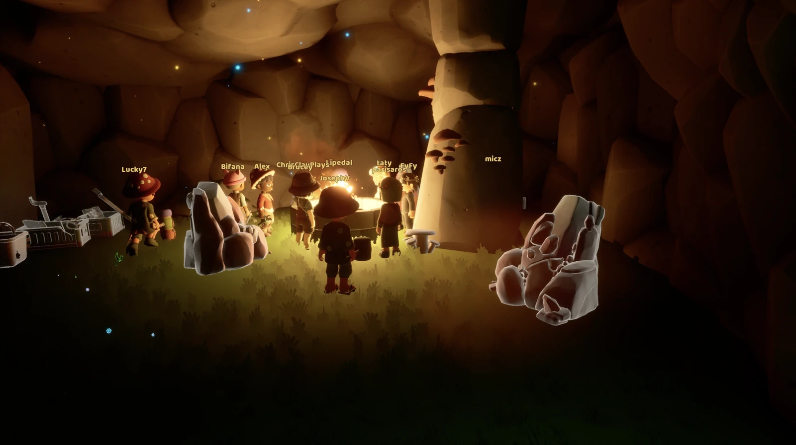 A group of Loftia players gathers around a light inside a rocky cave