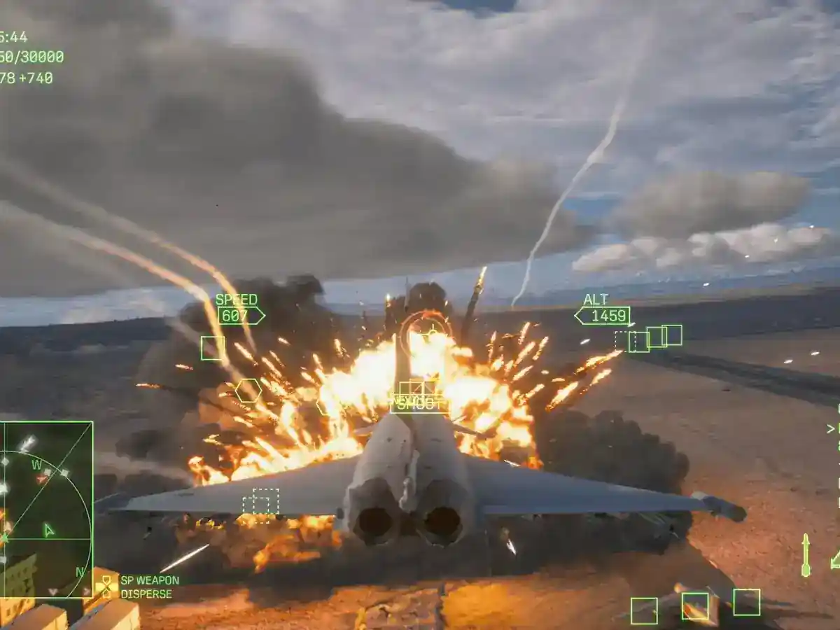 A fighter jet flies toward an explosion over a mountain range.