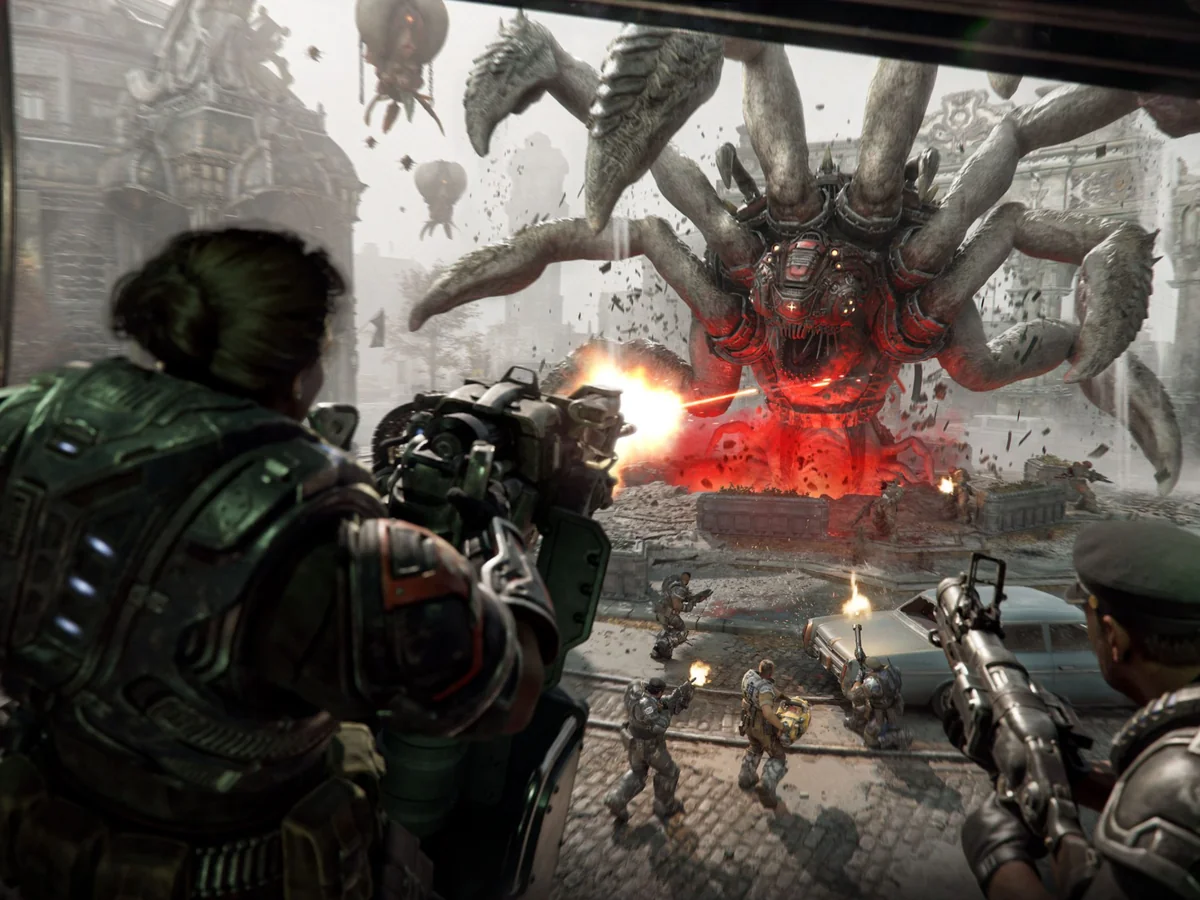 Gears fire from cover at a giant Corpser in a Gears of War: E-Day Horde Siege battle.