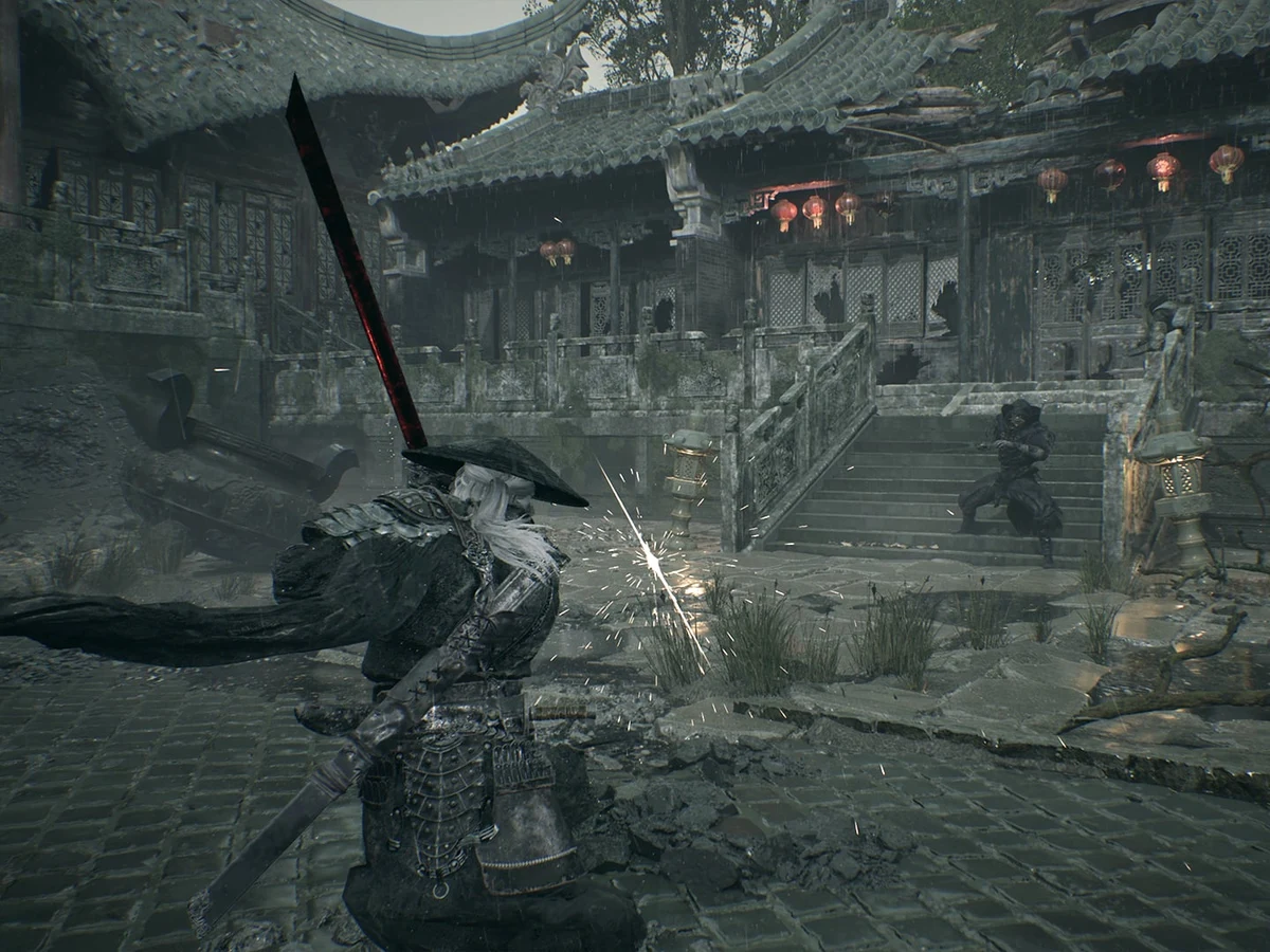 Soul raises a sword as sparks fly during a fight in a ruined courtyard.