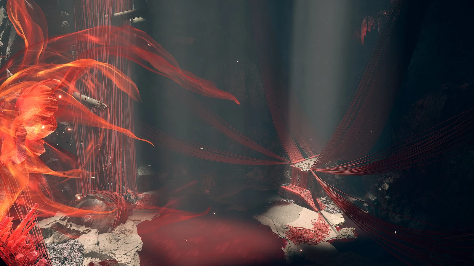 Red threads stretch across a rocky chamber beside glowing red fabric and a stone figure.