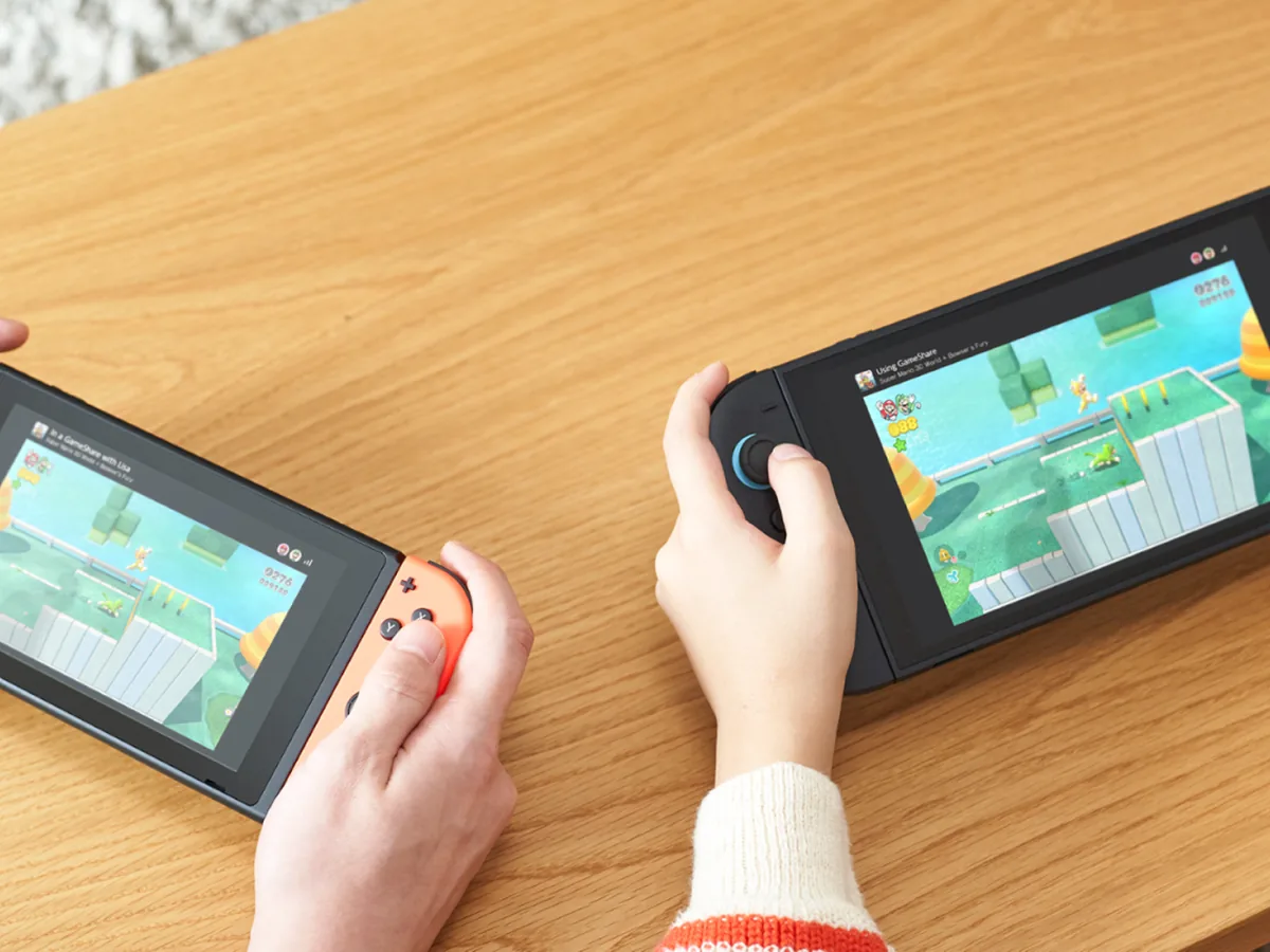 Nintendo Switch 2 GameShare artwork showing several players enjoying a shared multiplayer game on separate screens.