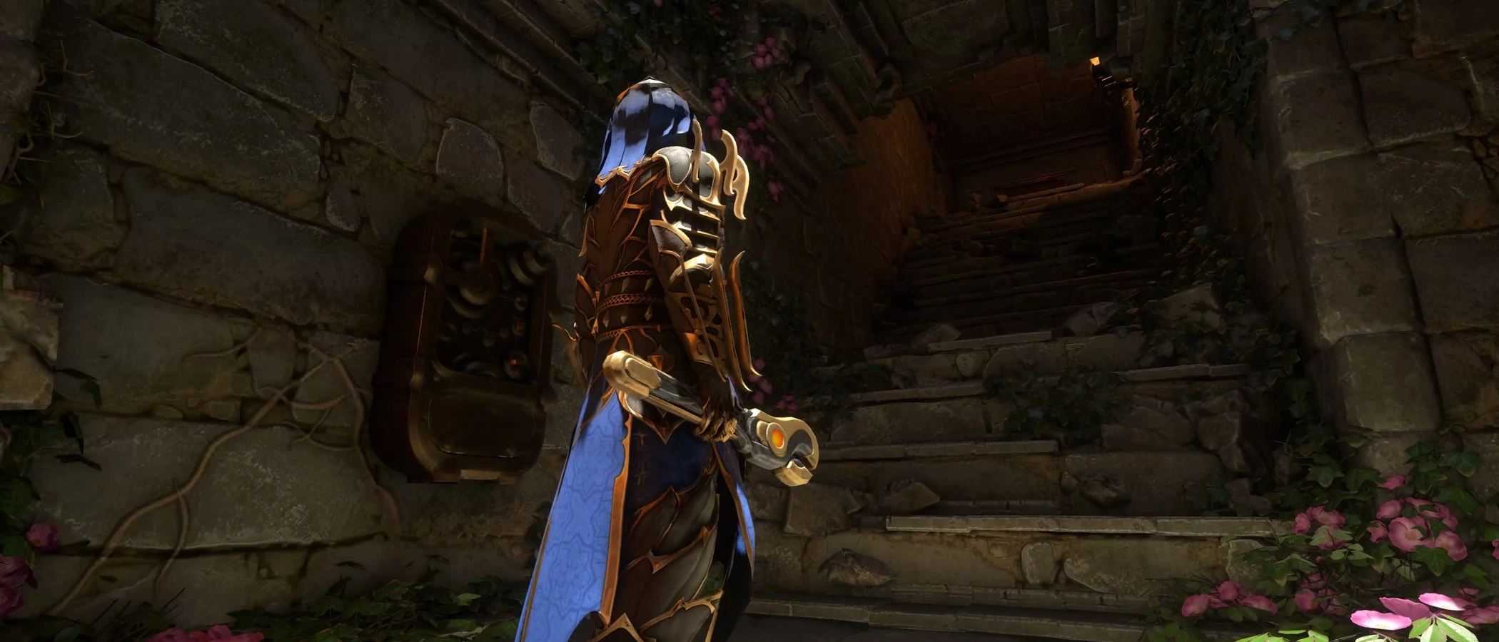 An armoured character holding a tool beside a wall-mounted mechanism and stone stairs in an Enshrouded dungeon.
