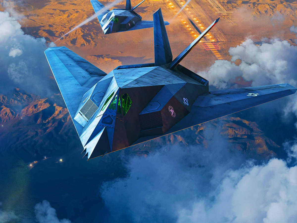 Two F-117 aircraft above a landscape in official War Thunder Firebirds artwork