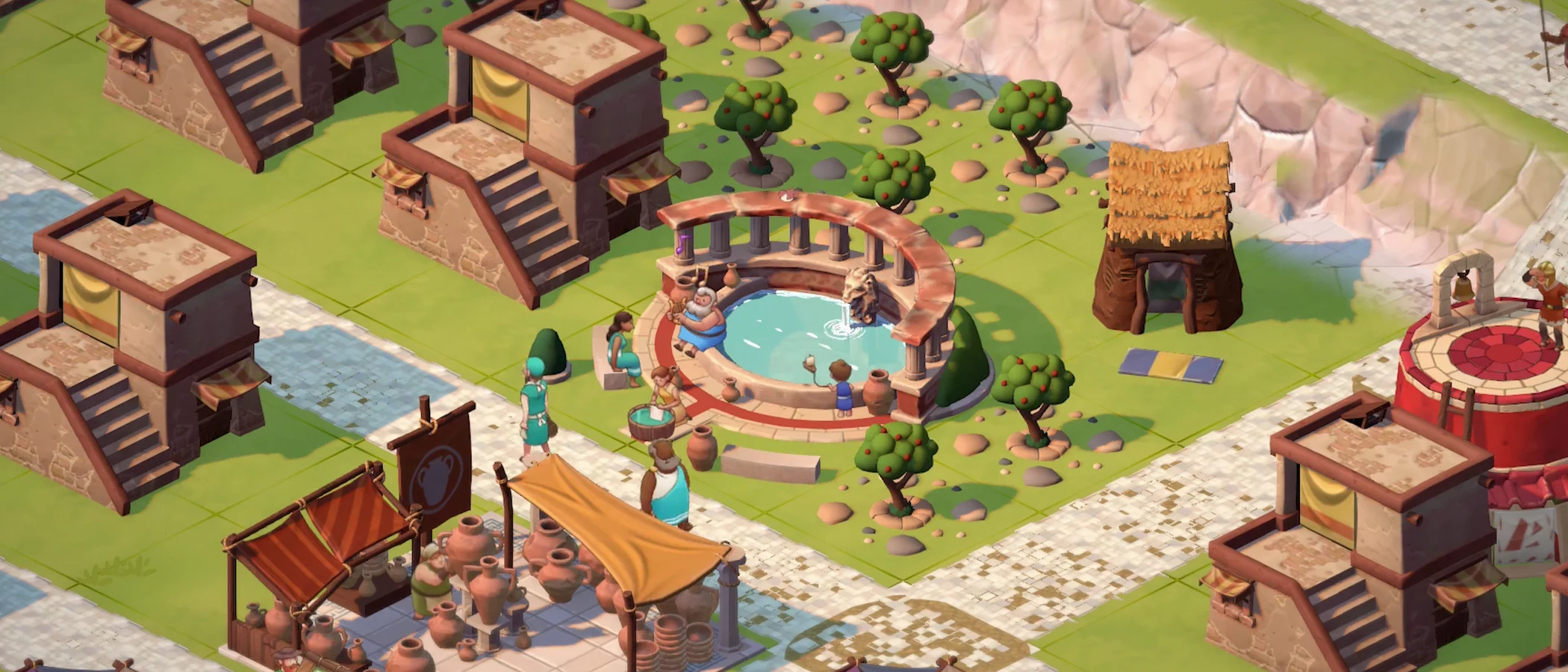 A fountain and market beside homes and paved roads in Theos: Cities of Myth