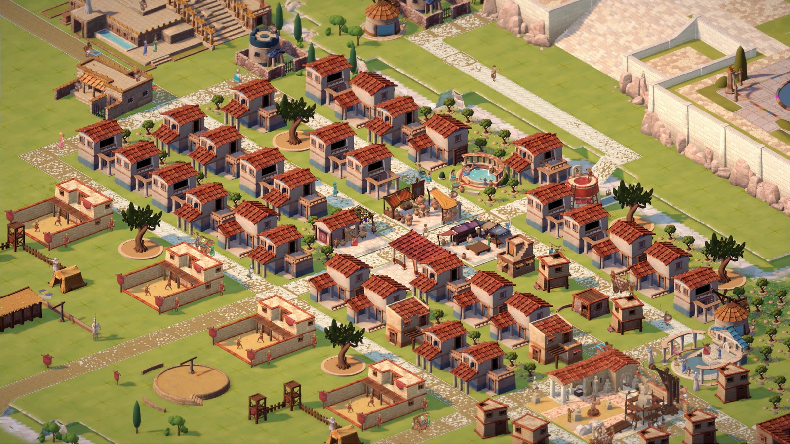 Rows of red-roofed homes and service buildings line roads beside a large sanctuary
