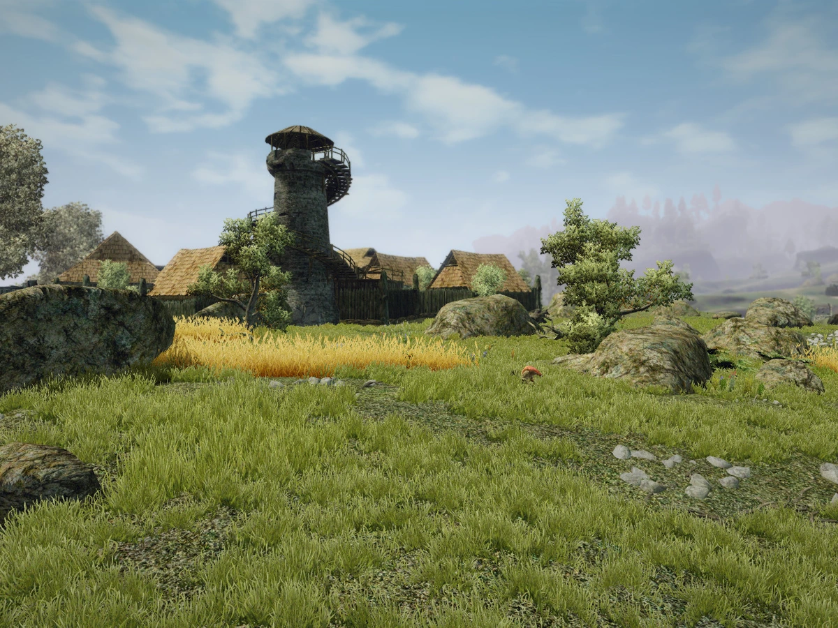 A stone tower and thatched buildings stand beside yellow crops in a green Gothic III landscape.