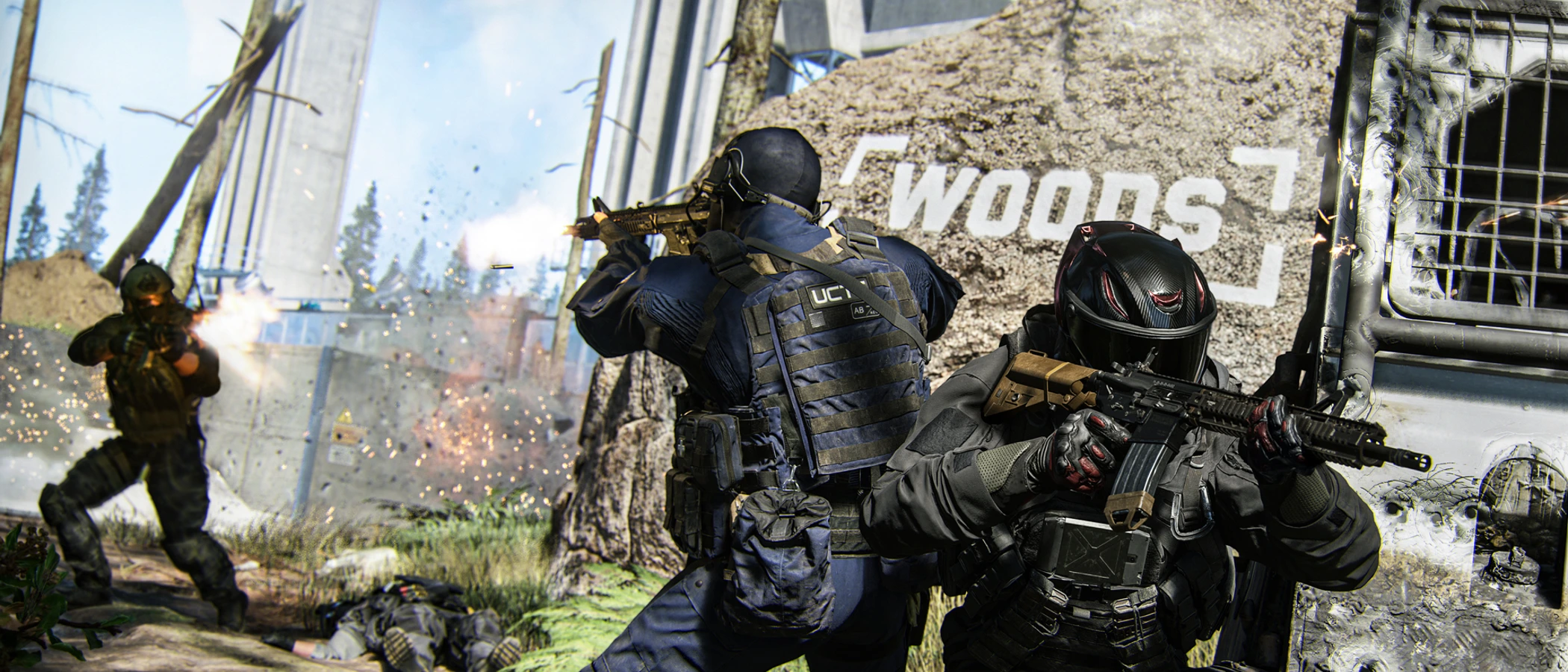 Three armed operators fight beside a wall marked Woods in the Kill Block training facility