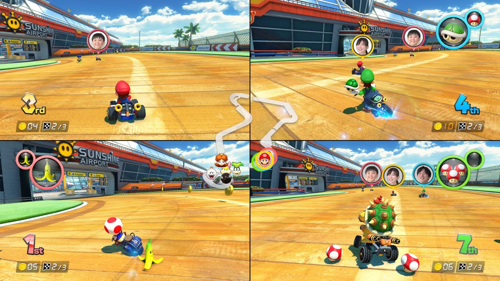 Four Mario Kart 8 Deluxe racers shown in split-screen with CameraPlay faces above their karts.