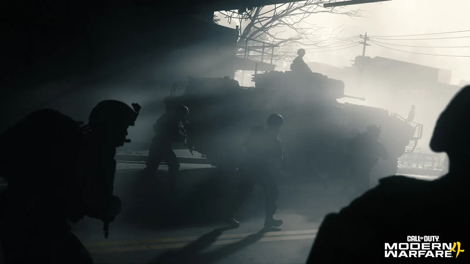 Infantry move beside a tank through a hazy street in Call of Duty: Modern Warfare 4.
