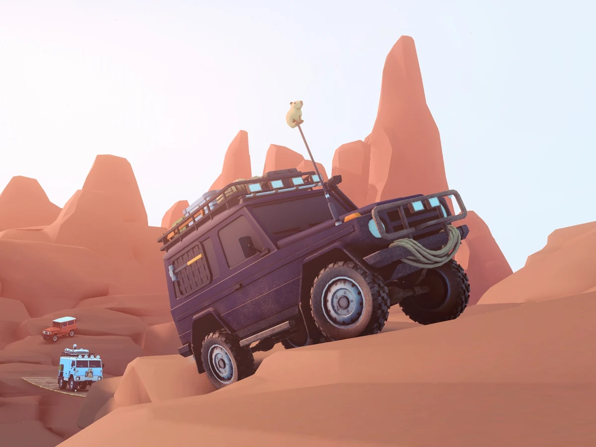 A luggage-laden off-road vehicle climbs a sandstone slope above a second car
