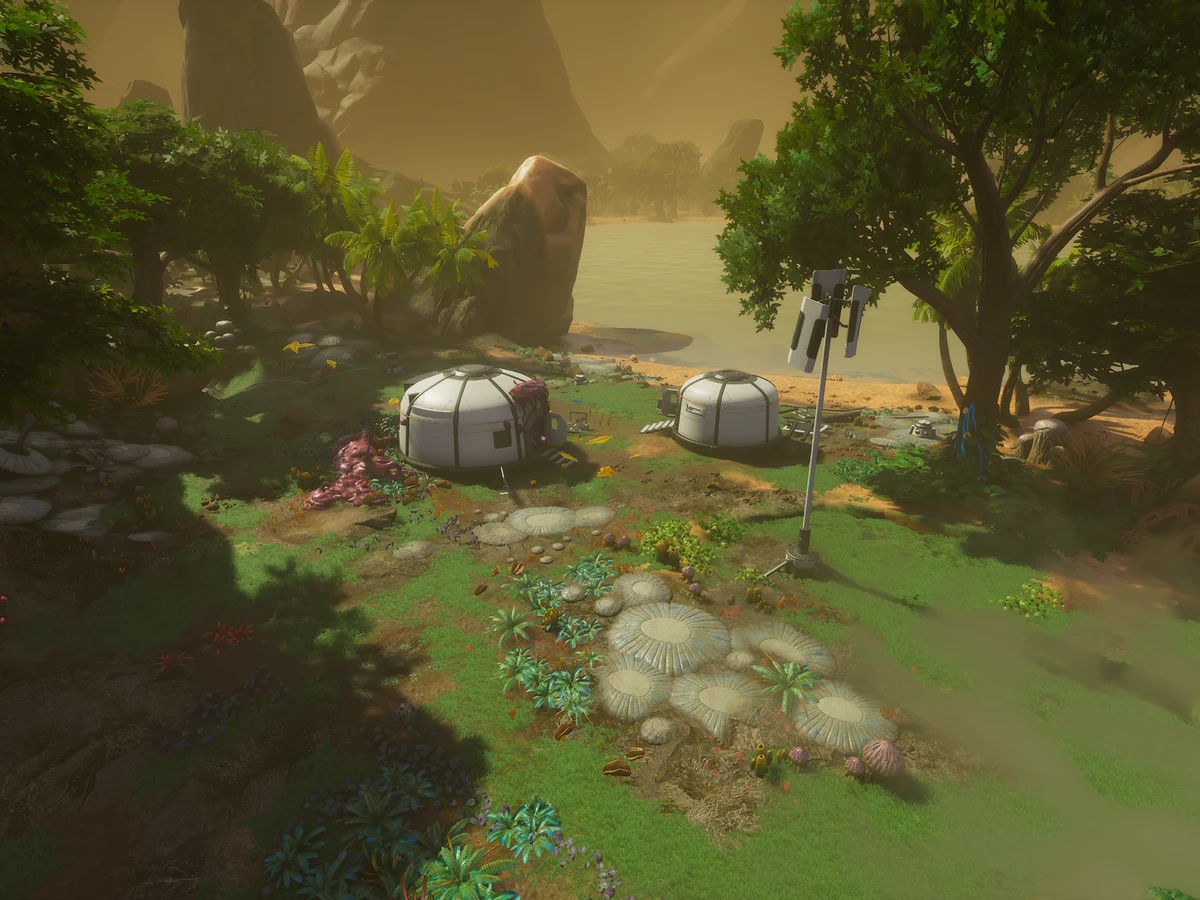 White habitat buildings stand beside water amid dense alien vegetation beneath Mars.