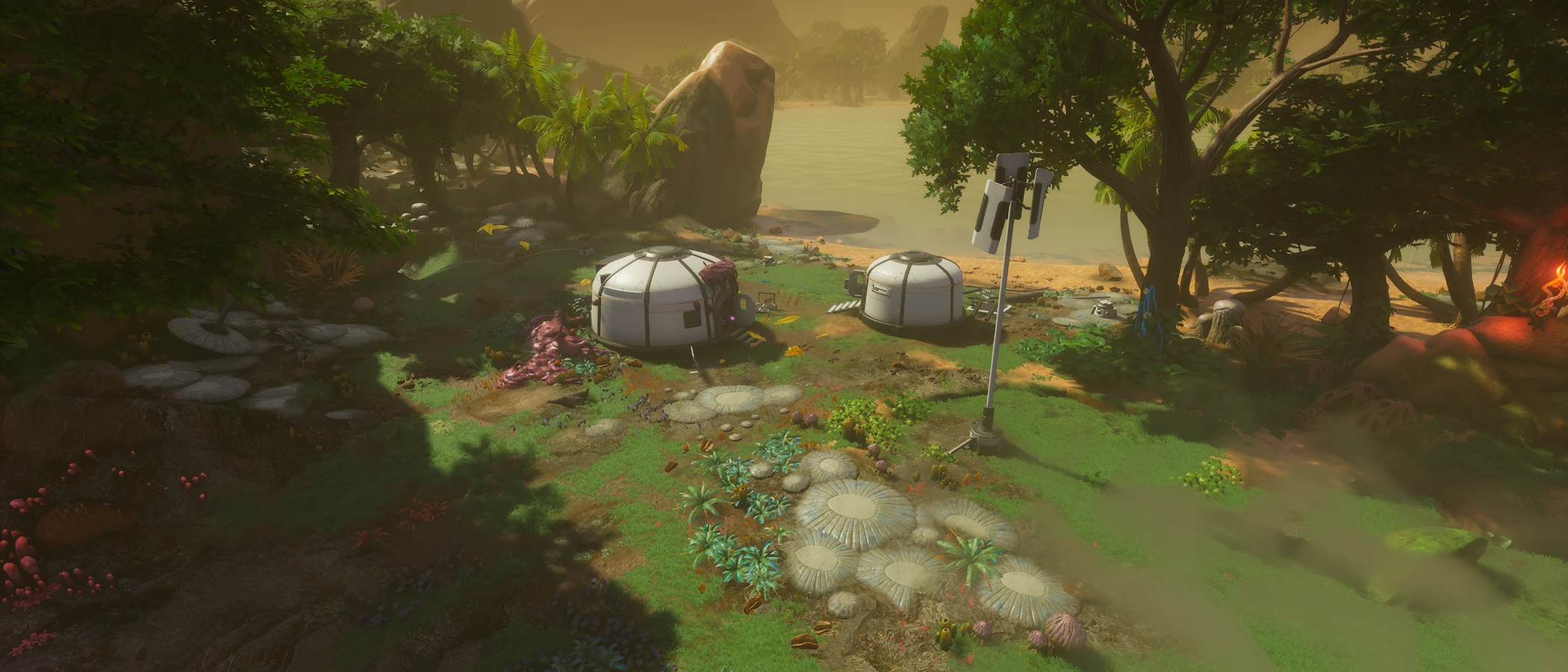 White habitat buildings stand beside water amid dense alien vegetation beneath Mars.