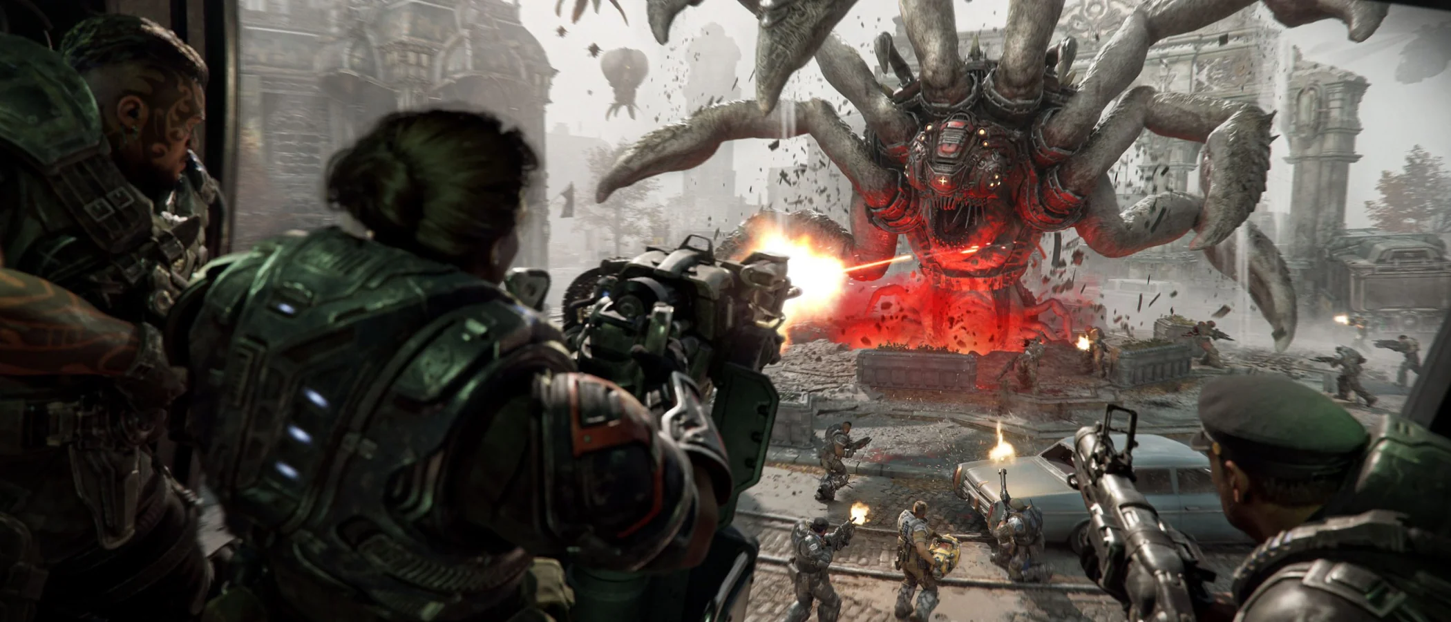 Gears fire from cover at a giant Corpser in a Gears of War: E-Day Horde Siege battle.