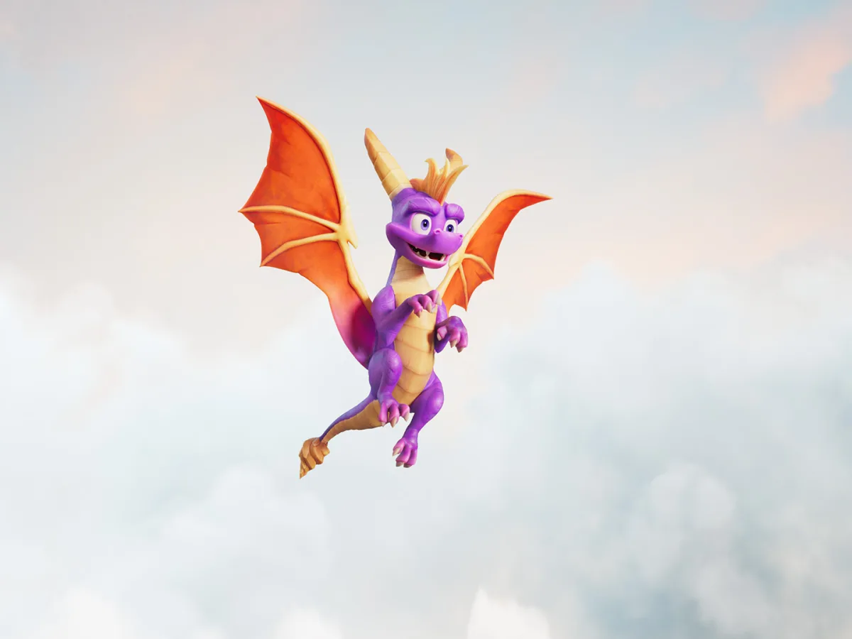 Spyro stands among grass, ruins and small creatures in the bright Arcadian Vale.