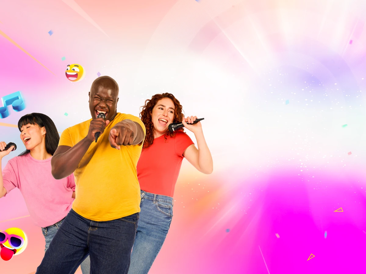 Three singers holding microphones against a pink and blue background