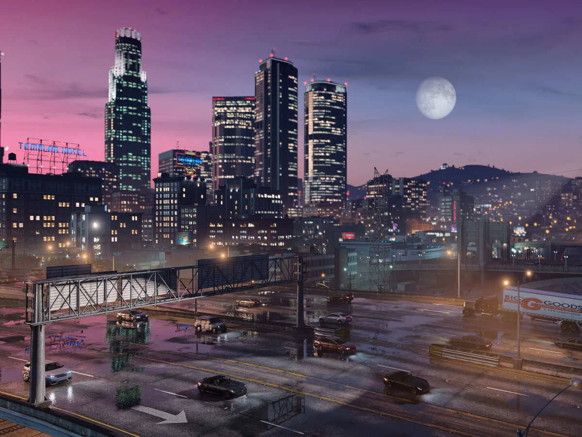 The Los Santos skyline and illuminated roads at dusk in Grand Theft Auto V Enhanced.