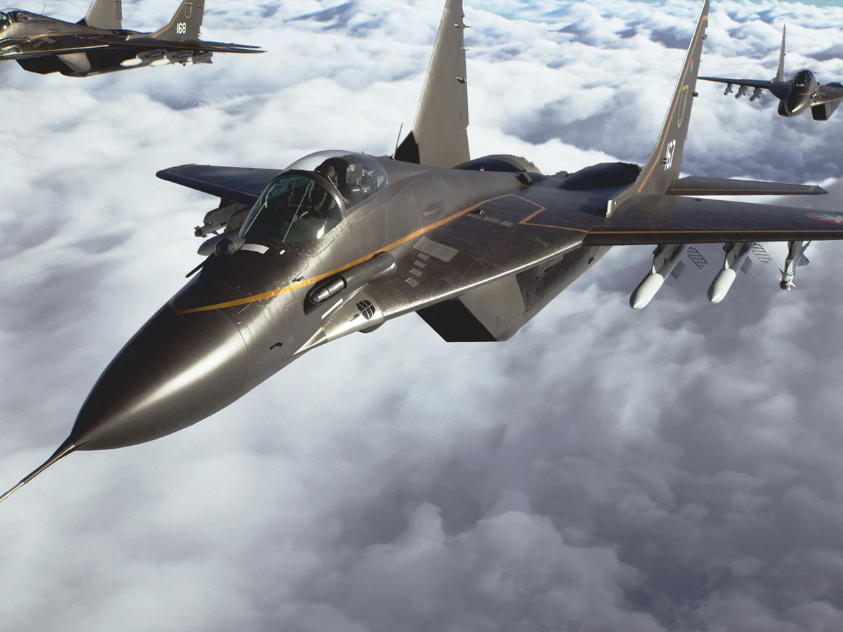 Fighter jets fly together above a bank of white clouds
