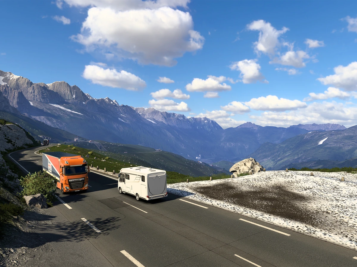 An orange truck beside a camper on an Alpine road in Euro Truck Simulator 2