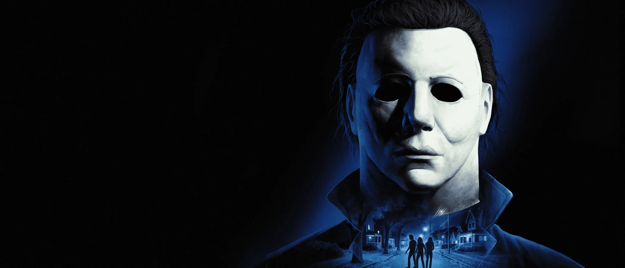 Michael Myers in a white mask is lit in blue above a night-time Haddonfield street.