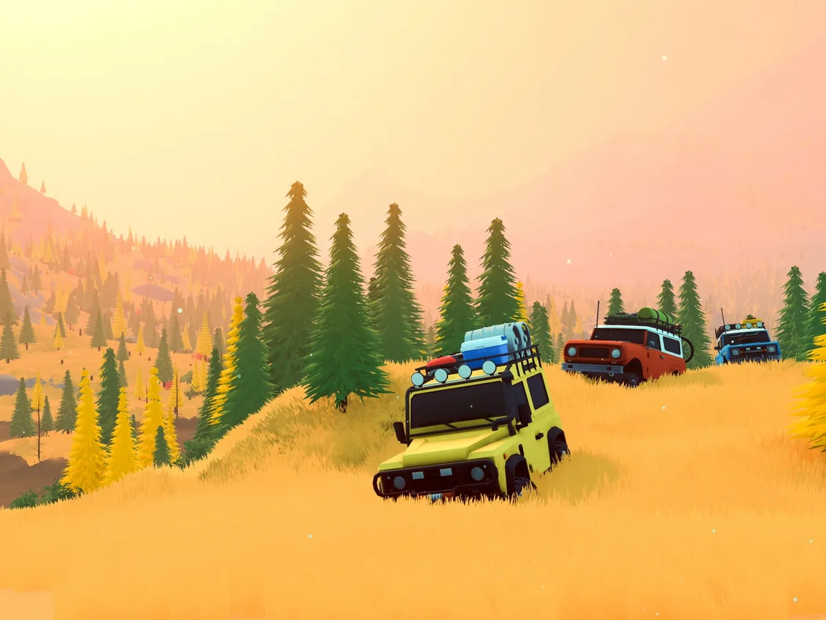 Four off-road vehicles descend a grassy slope in over the hill