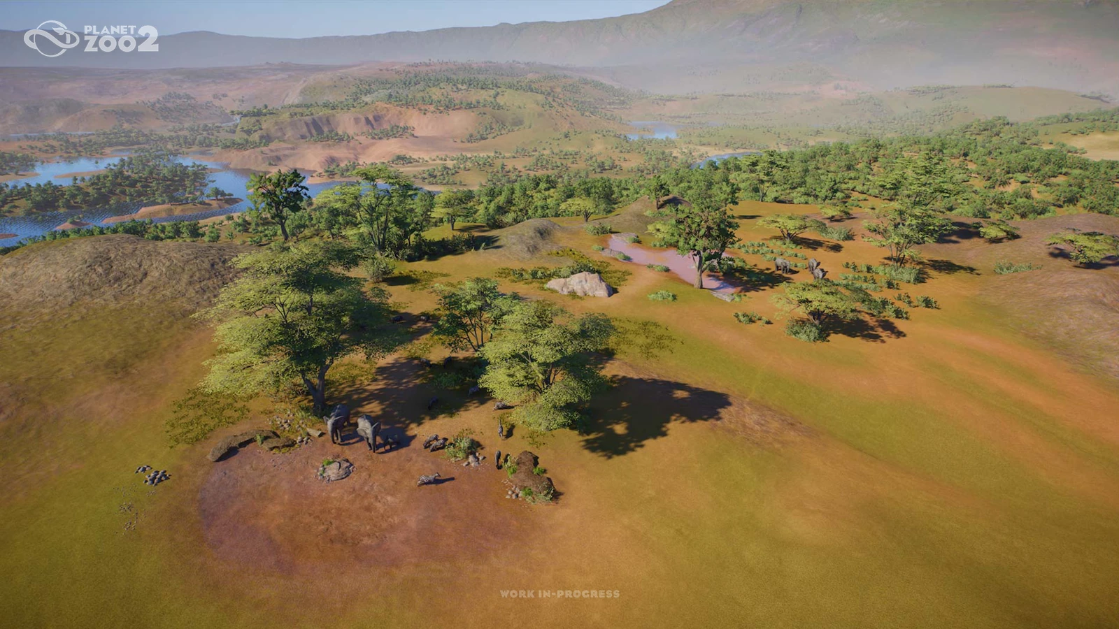 A wide view of elephants, trees and water in the landscape built for Planet Zoo 2's announcement trailer.