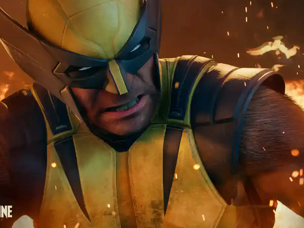 Wolverine wears a yellow and black suit while standing amid flames.