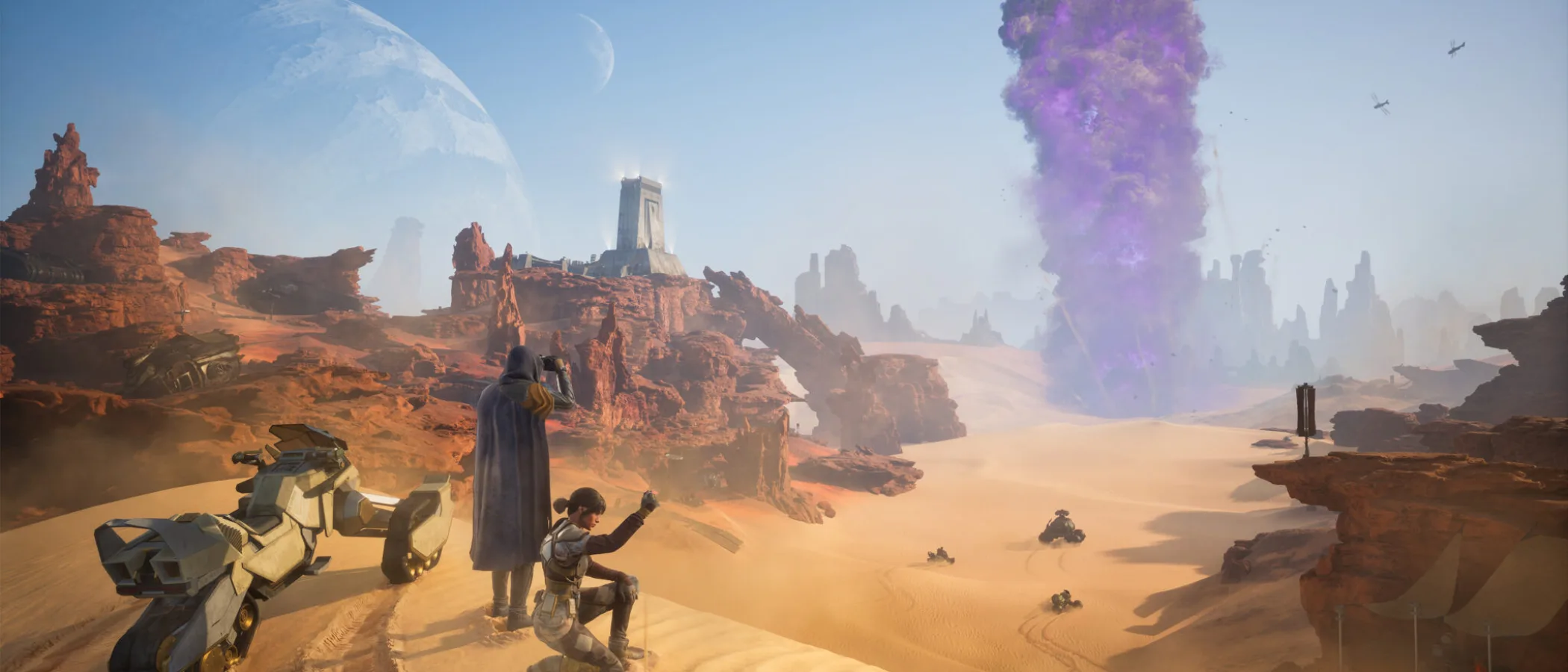 Two figures overlook a rocky desert valley on Arrakis beside a sandbike.