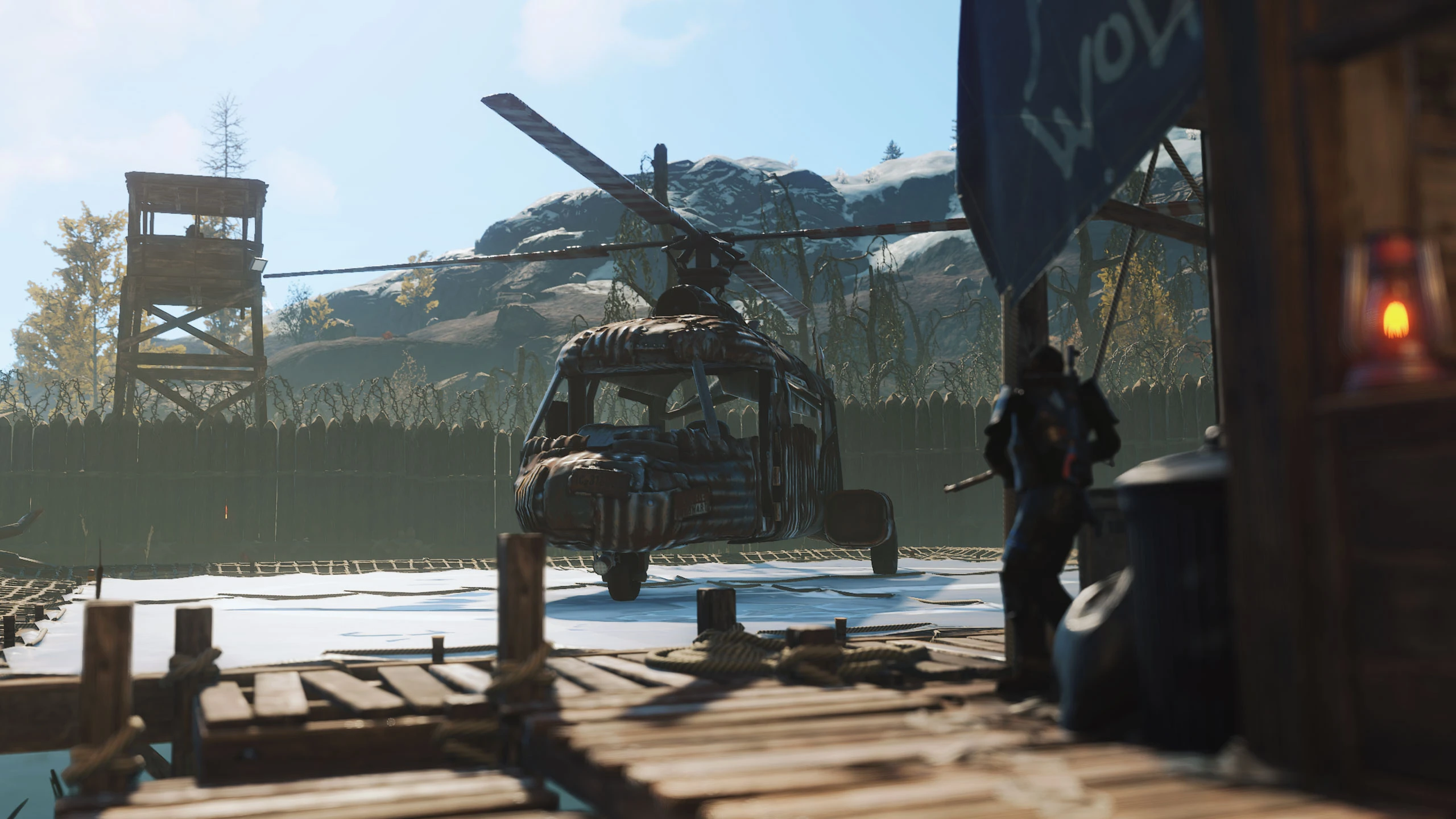 An Air Wolf vendor stands beside the shop window with a helicopter on the nearby landing pad.