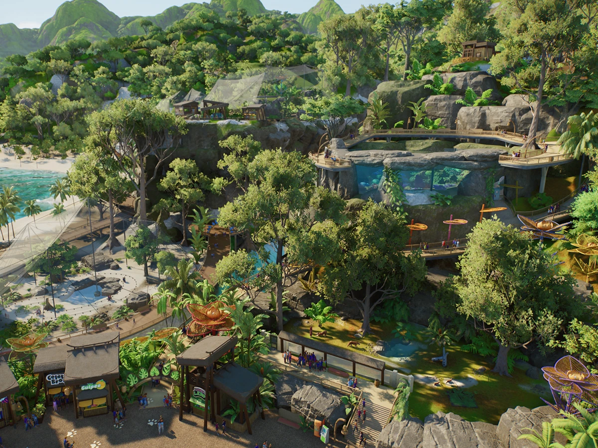 A tropical Planet Zoo 2 zoo with winding paths, themed shops and aquatic habitats.