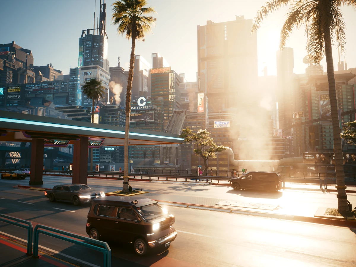Sunlight falls across Night City buildings and traffic in Cyberpunk 2077